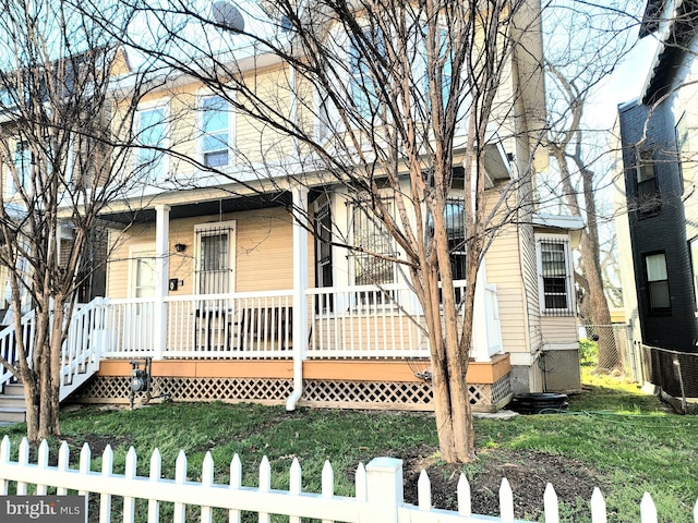 view of front facade with central AC unit and a porch