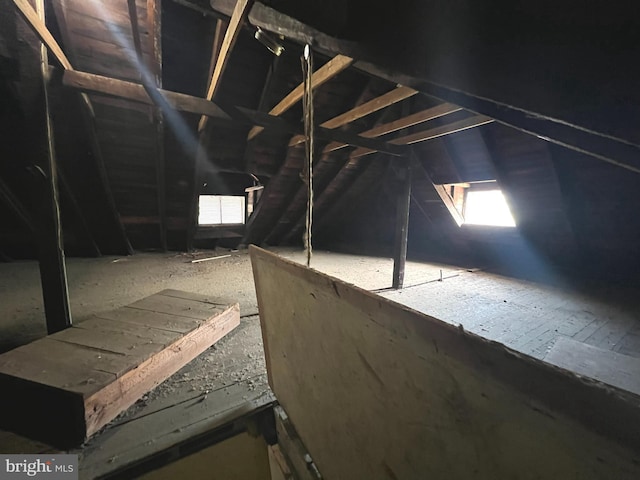 attic featuring a wealth of natural light