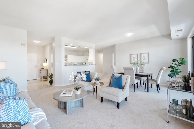 living room featuring light carpet