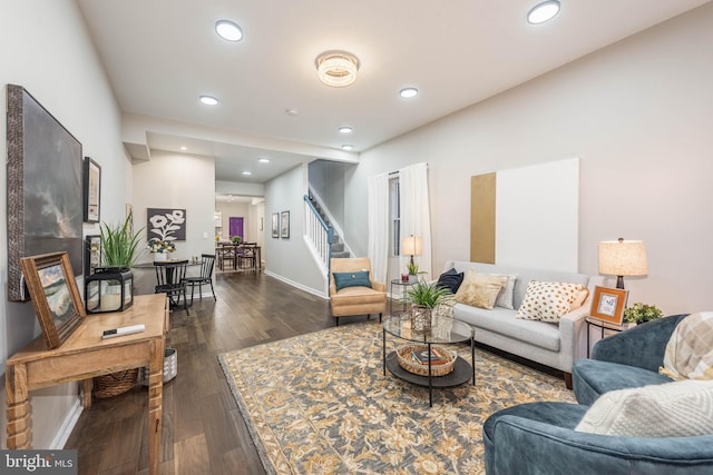 living room featuring dark wood-type flooring