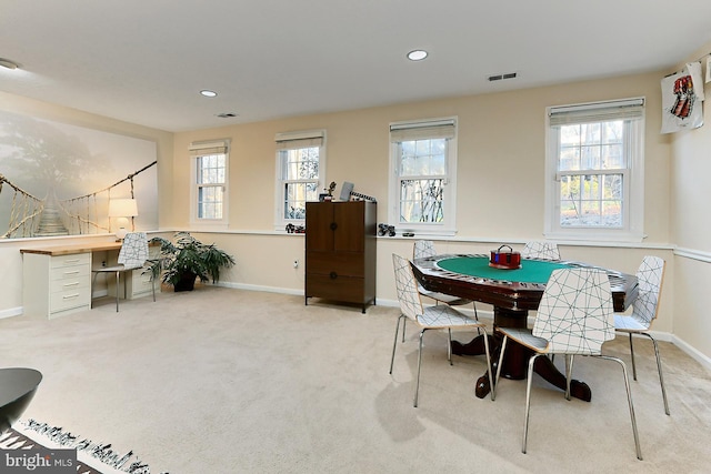 recreation room with light carpet and plenty of natural light