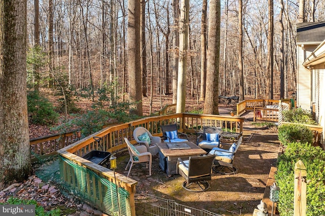 deck featuring an outdoor fire pit