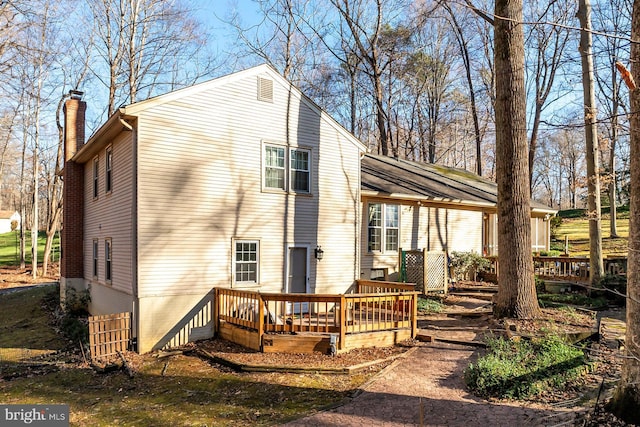 rear view of house with a deck