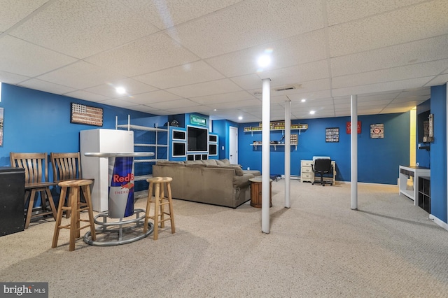 143 Mayor Ln, Felton, DE 19943 - carpeted living room with a paneled ceiling and a dry bar