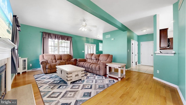 143 Mayor Ln, Felton, DE 19943 - living room with a fireplace with flush hearth, ceiling fan, and hardwood / wood-style floors