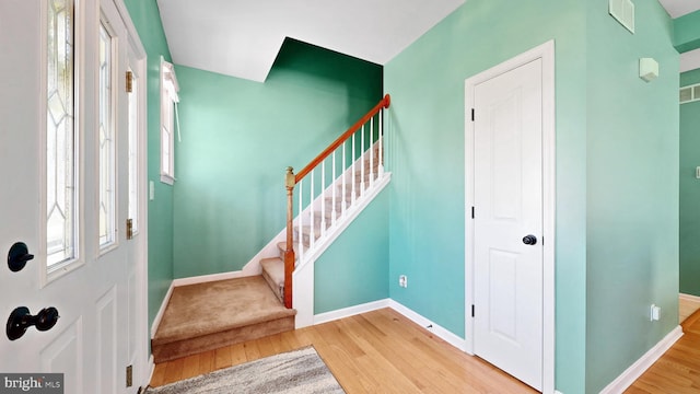 143 Mayor Ln, Felton, DE 19943 - entrance foyer with wood finished floors and stairway