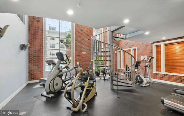 workout area featuring floor to ceiling windows