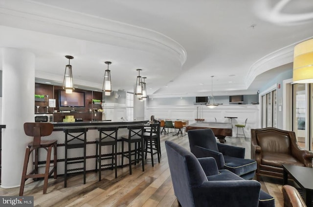 interior space with crown molding and light hardwood / wood-style floors