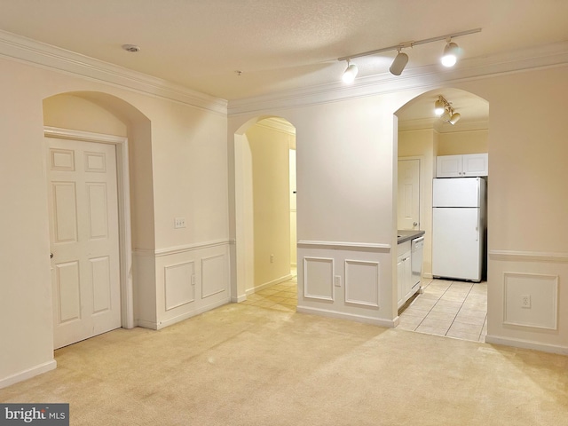 carpeted spare room with crown molding