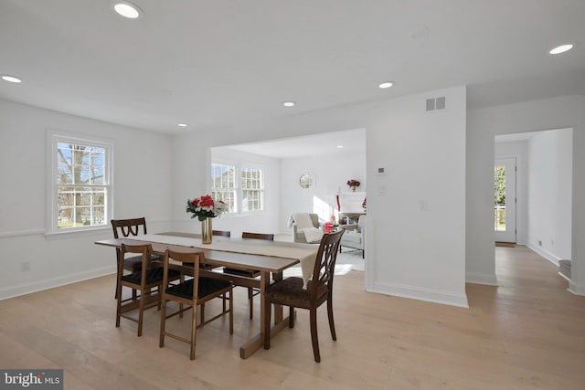 dining space featuring light hardwood / wood-style flooring