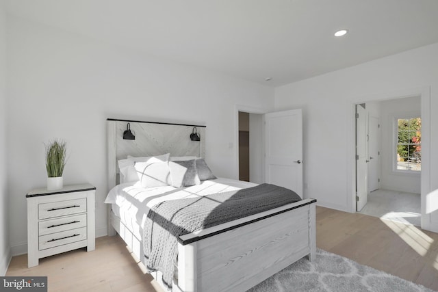 bedroom with light hardwood / wood-style floors