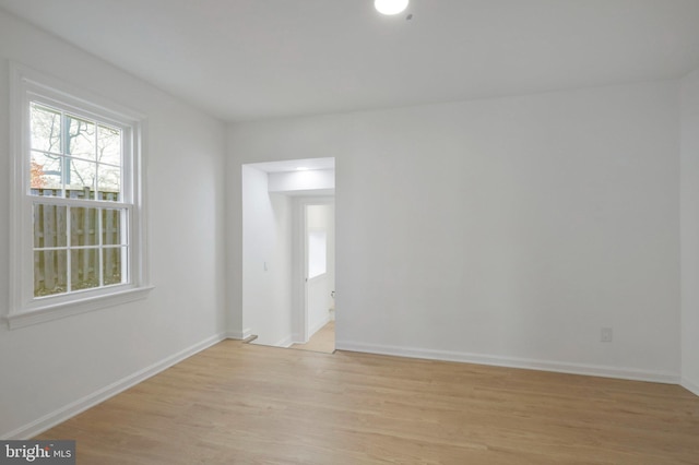 spare room with light hardwood / wood-style floors