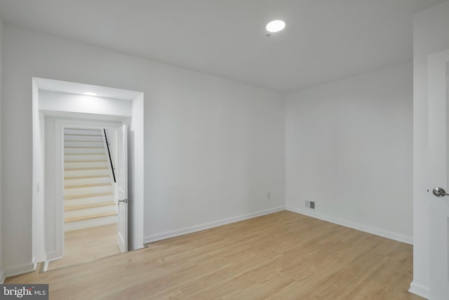 unfurnished room with light hardwood / wood-style floors