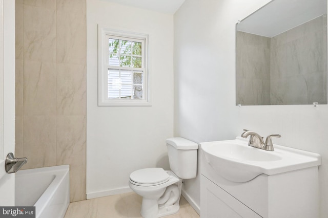 bathroom featuring tile patterned floors, vanity, and toilet