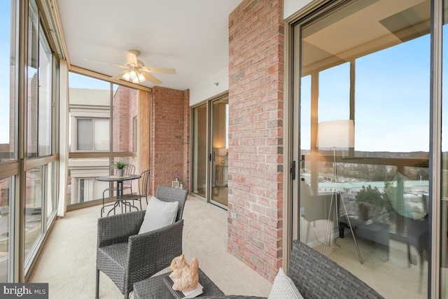 sunroom / solarium with ceiling fan