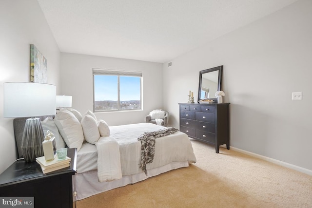 bedroom with light carpet