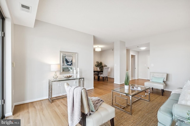 living room with light hardwood / wood-style floors