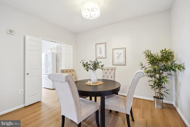 dining space featuring hardwood / wood-style floors