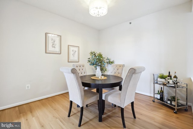 dining room with light wood-type flooring