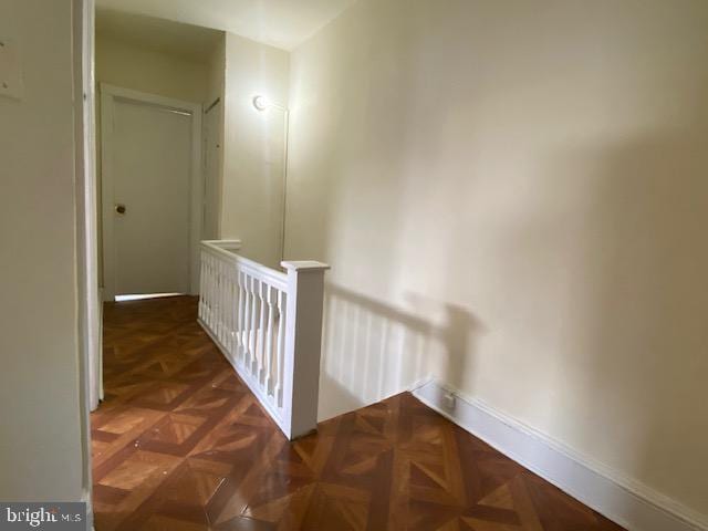 corridor with dark parquet floors