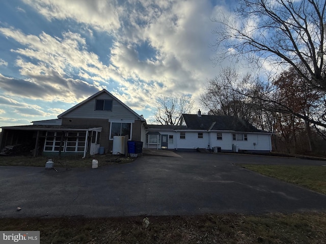 view of front of home featuring a sunroom