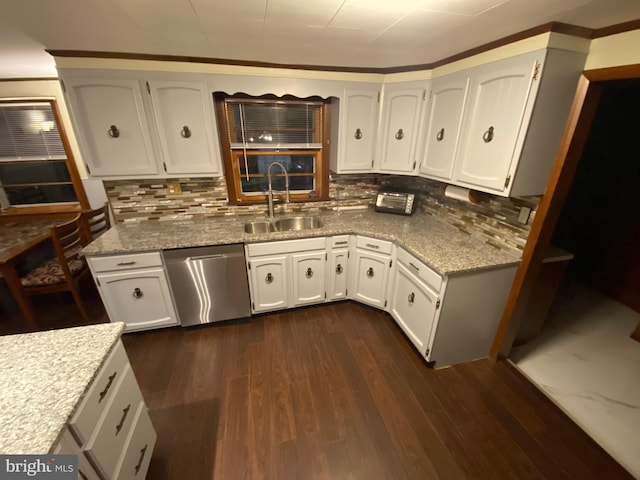 kitchen featuring dark hardwood / wood-style flooring, white cabinets, and stainless steel dishwasher