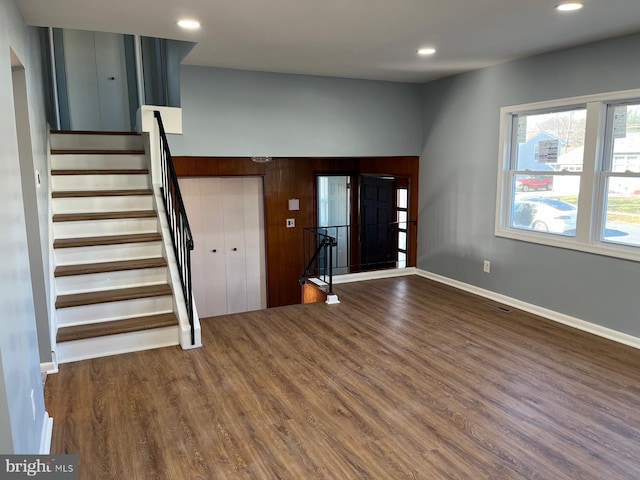 entryway with dark wood-type flooring