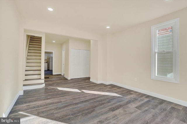 unfurnished room with dark hardwood / wood-style floors