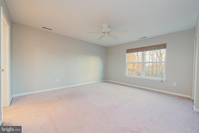 empty room with light carpet and ceiling fan