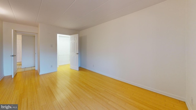 unfurnished bedroom featuring light wood-type flooring