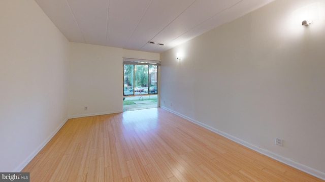 spare room featuring light hardwood / wood-style flooring