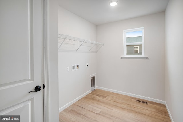 35551 Aspen Way, Locust Grove, VA 22508 - clothes washing area featuring washer hookup, light hardwood / wood-style flooring, and electric dryer hookup
