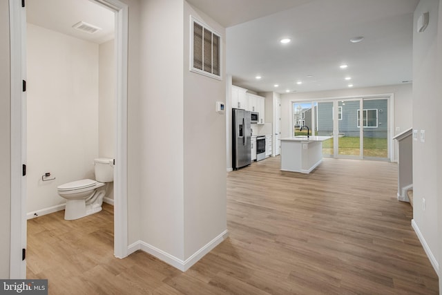 35551 Aspen Way, Locust Grove, VA 22508 - corridor with sink and light wood-type flooring