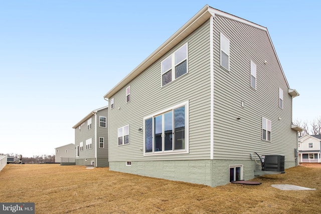 35551 Aspen Way, Locust Grove, VA 22508 - rear view of house featuring cooling unit and a lawn