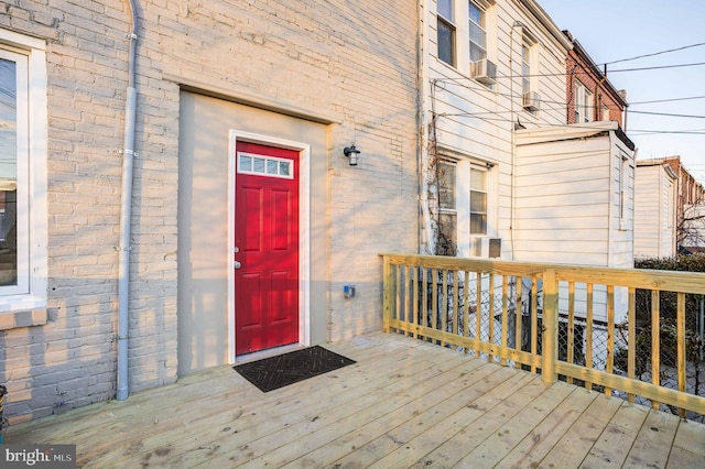 property entrance with a deck