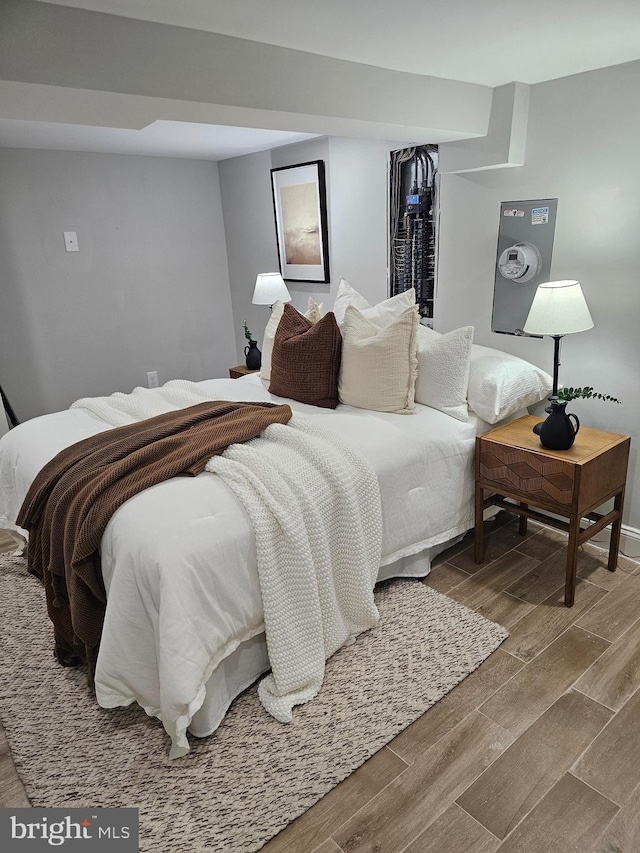 bedroom with wood-type flooring