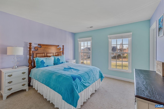 bedroom with light colored carpet