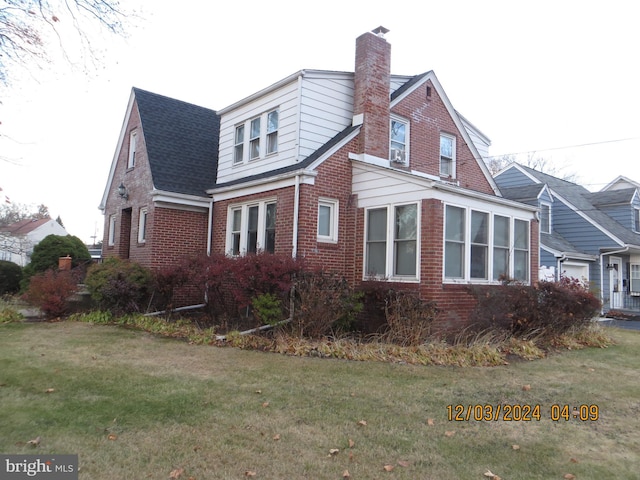 view of property exterior featuring a lawn