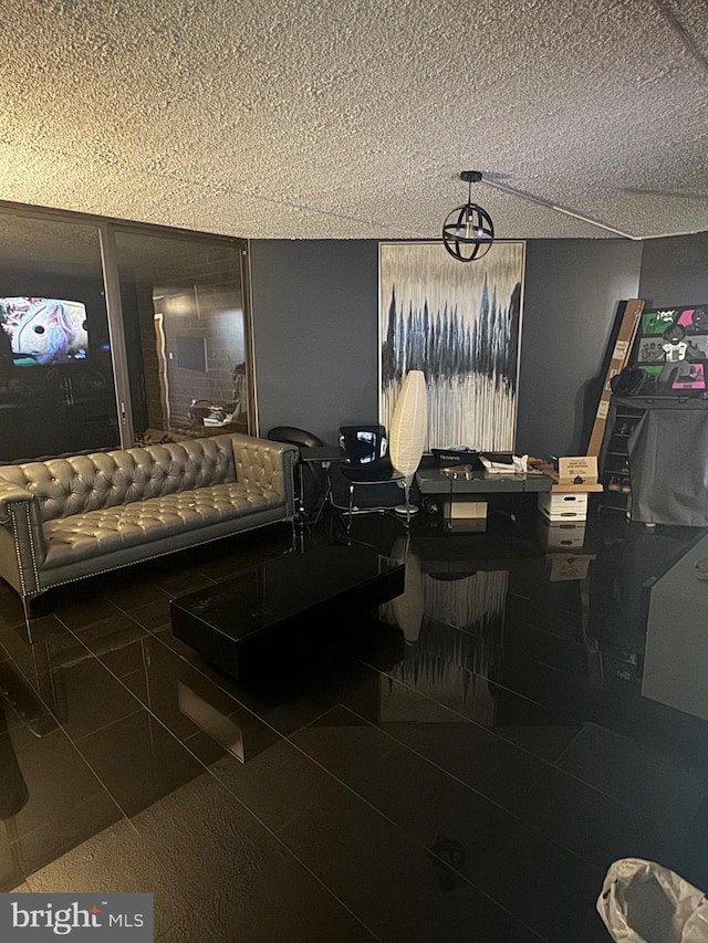 interior space with a textured ceiling and tile patterned floors