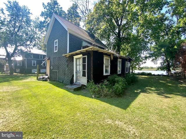 view of home's exterior featuring a yard