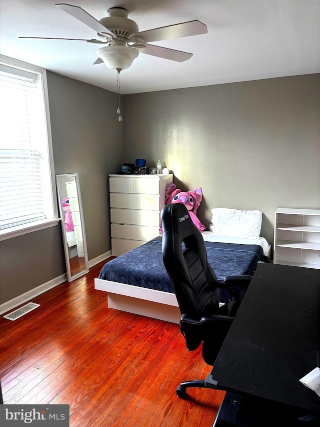 451 Ridge Pike, Lafayette Hill, PA 19444 - bedroom with baseboards, multiple windows, wood finished floors, and a ceiling fan