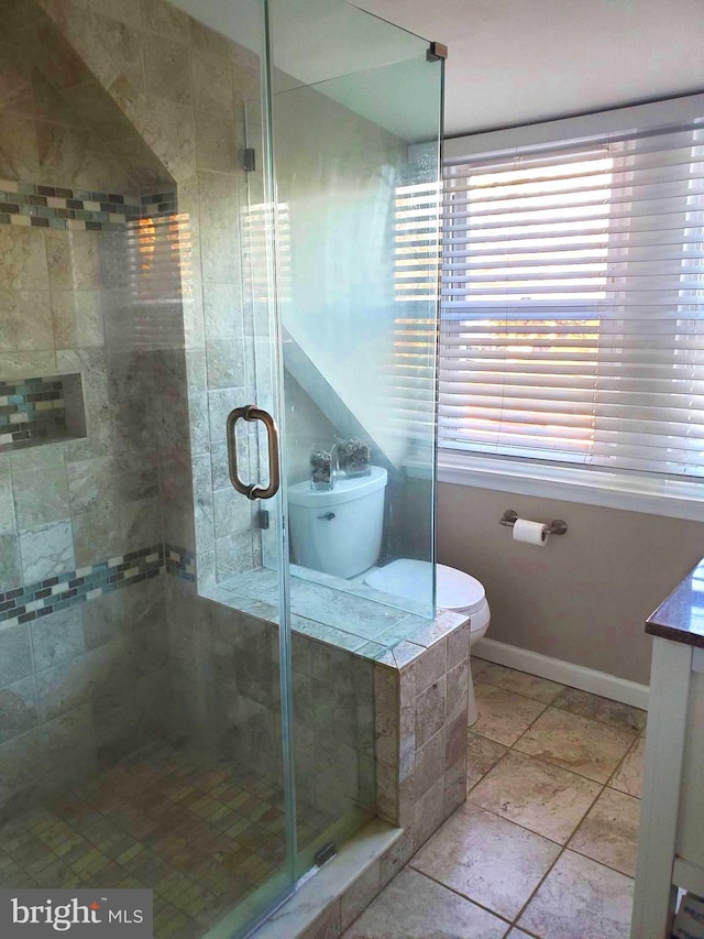 451 Ridge Pike, Lafayette Hill, PA 19444 - full bathroom featuring vanity, a stall shower, toilet, baseboards, and tile patterned flooring