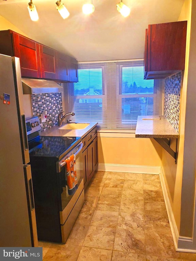 451 Ridge Pike, Lafayette Hill, PA 19444 - kitchen featuring appliances with stainless steel finishes, a sink, tasteful backsplash, extractor fan, and baseboards