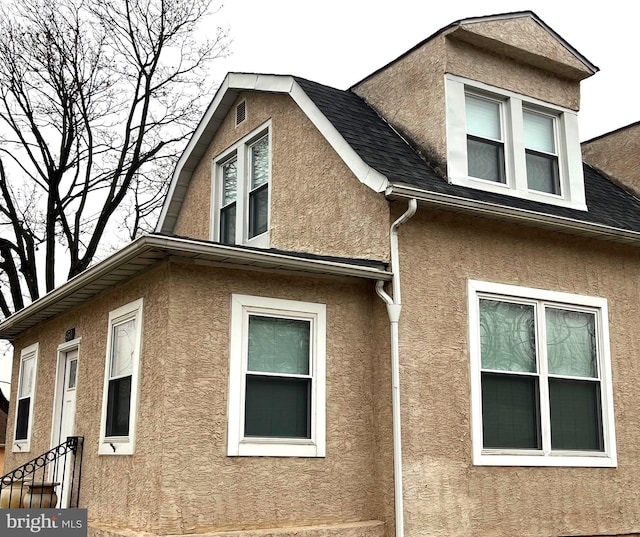 451 Ridge Pike, Lafayette Hill, PA 19444 - view of home's exterior featuring stucco siding and a shingled roof