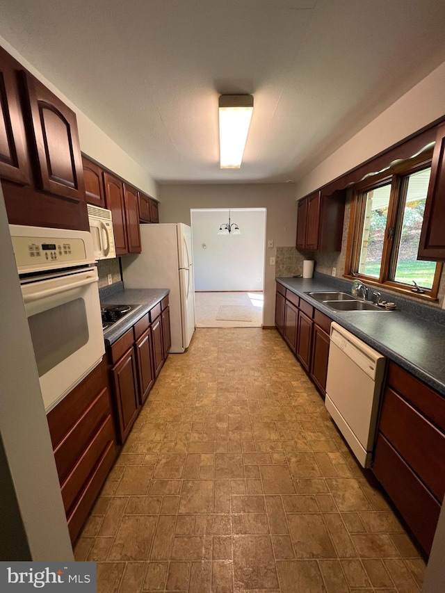 kitchen with sink and white appliances