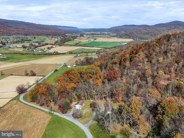 drone / aerial view with a mountain view and a rural view