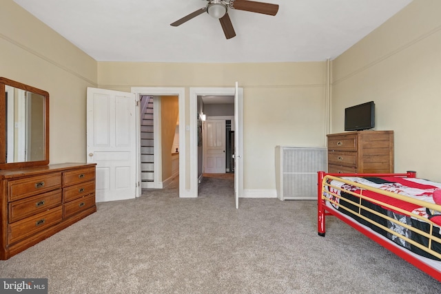 bedroom featuring ceiling fan and carpet floors