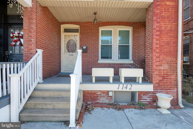 entrance to property with a porch