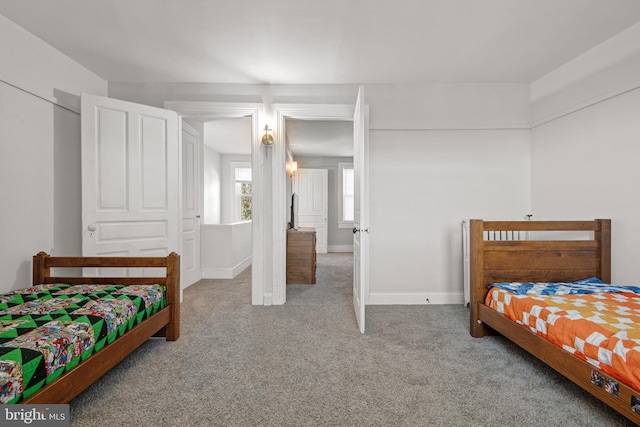 bedroom with carpet and a closet