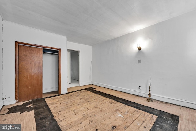 unfurnished bedroom featuring wood-type flooring